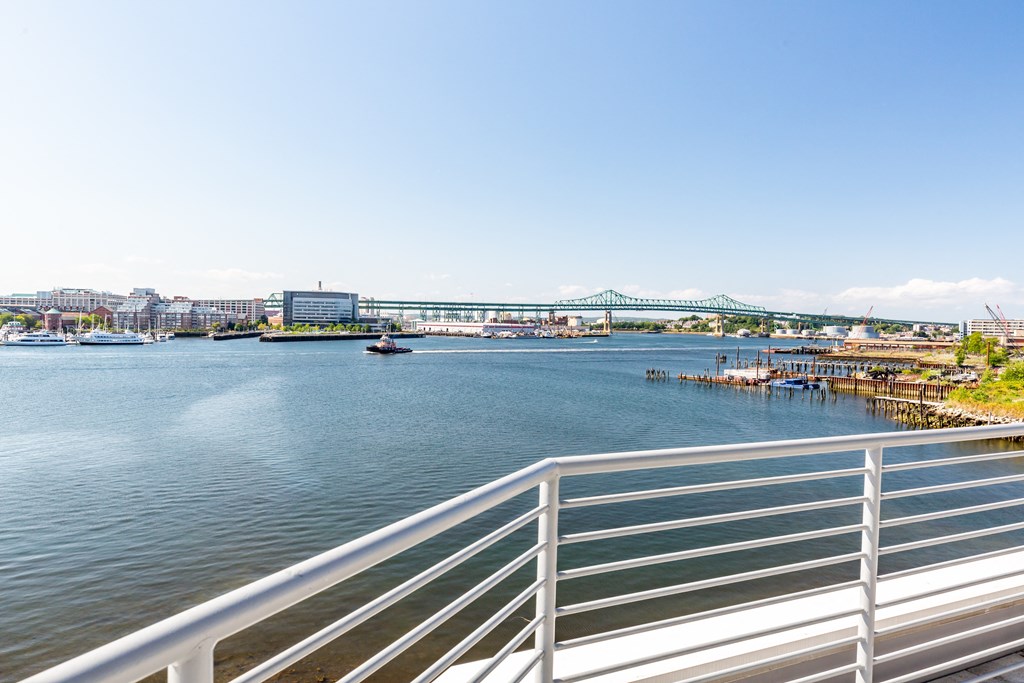 a view of a river and a bridge in a city