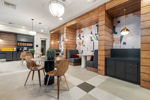 A modern kitchen with a dining area and a bar.