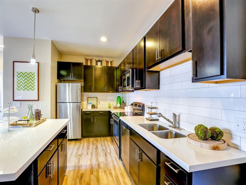 Kitchen with sink and refrigerator at Pearl DTC, Denver, CO, 80237