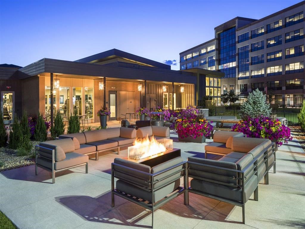 Patio with couches and a fire pit at Pearl DTC, Denver