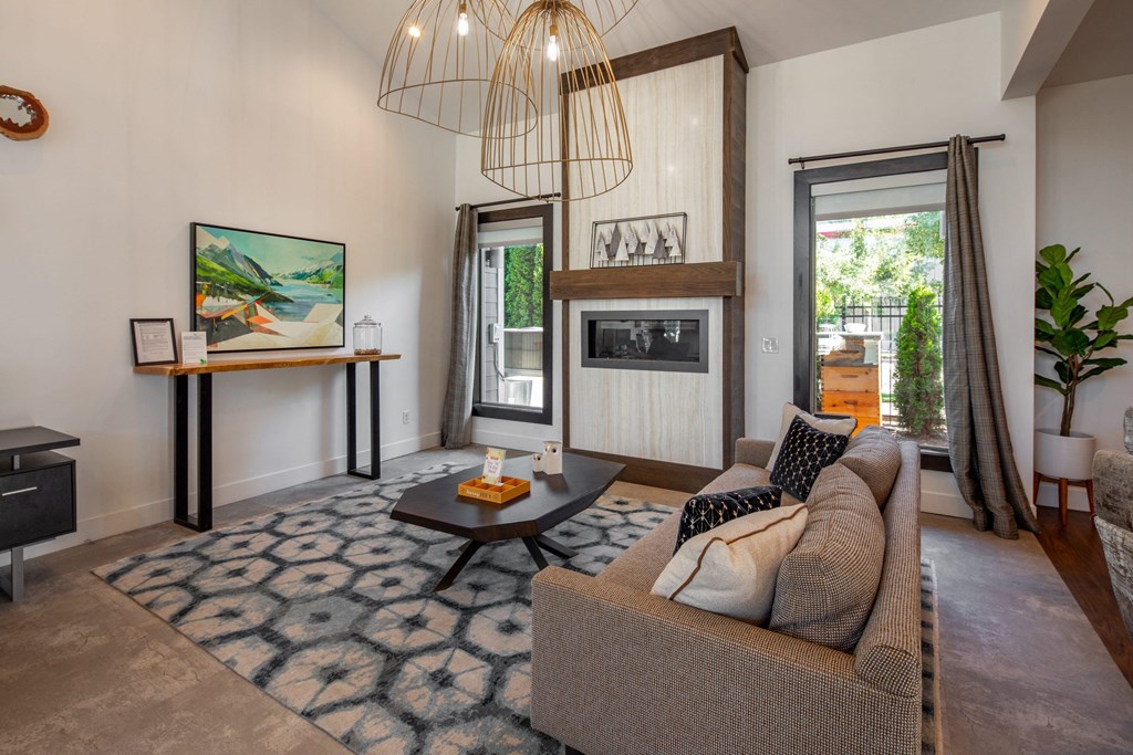 a living room with a couch and a fireplace