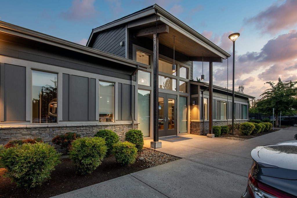 a view of the front of a building at dusk