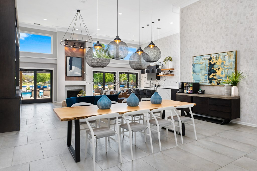 a dining room with a wooden table and chairs