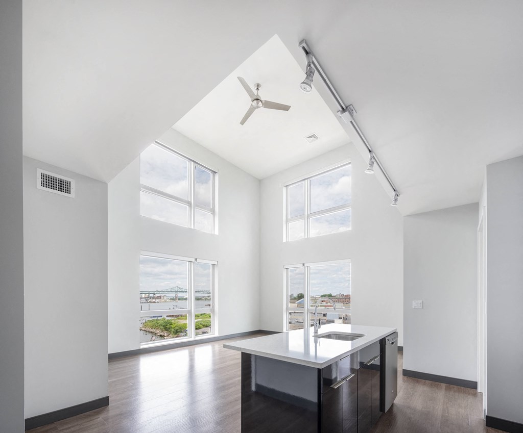 a living room with a large window and a table