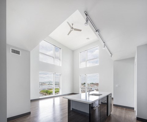 a living room with a large window and a table