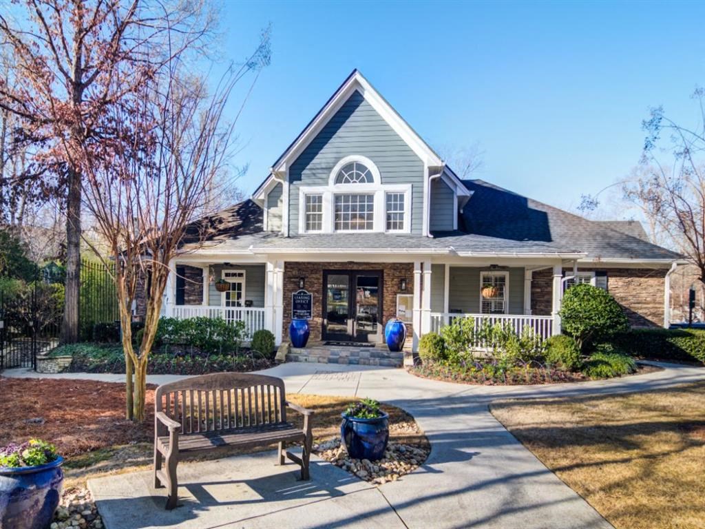 a house with a wooden bench in front of it