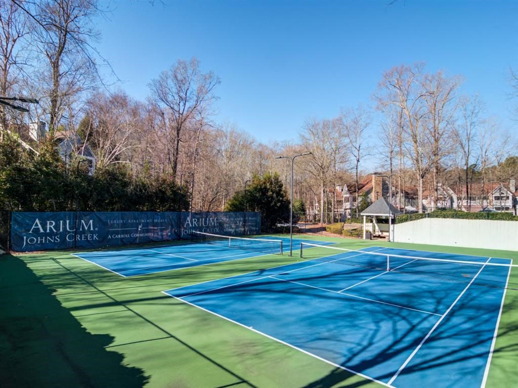 a tennis court with a blue and green court