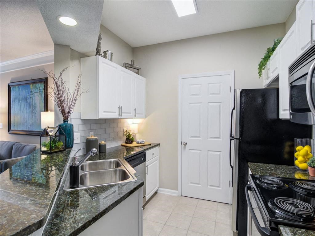a kitchen with a counter top and a sink