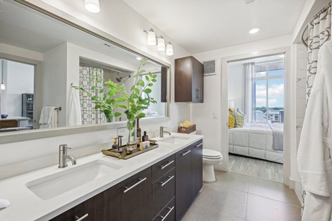a bathroom with a large mirror and a sink