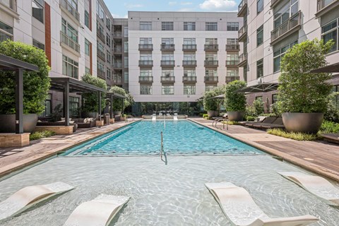 a swimming pool in the middle of an apartment building