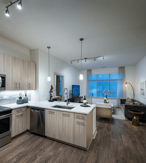 a kitchen with an island and a sink in a house