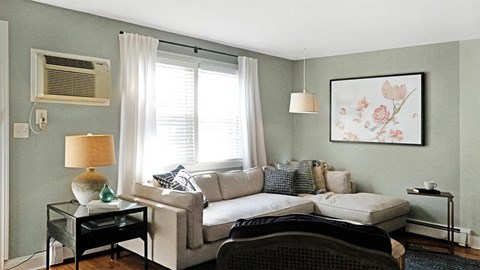 a living room with a couch and a window