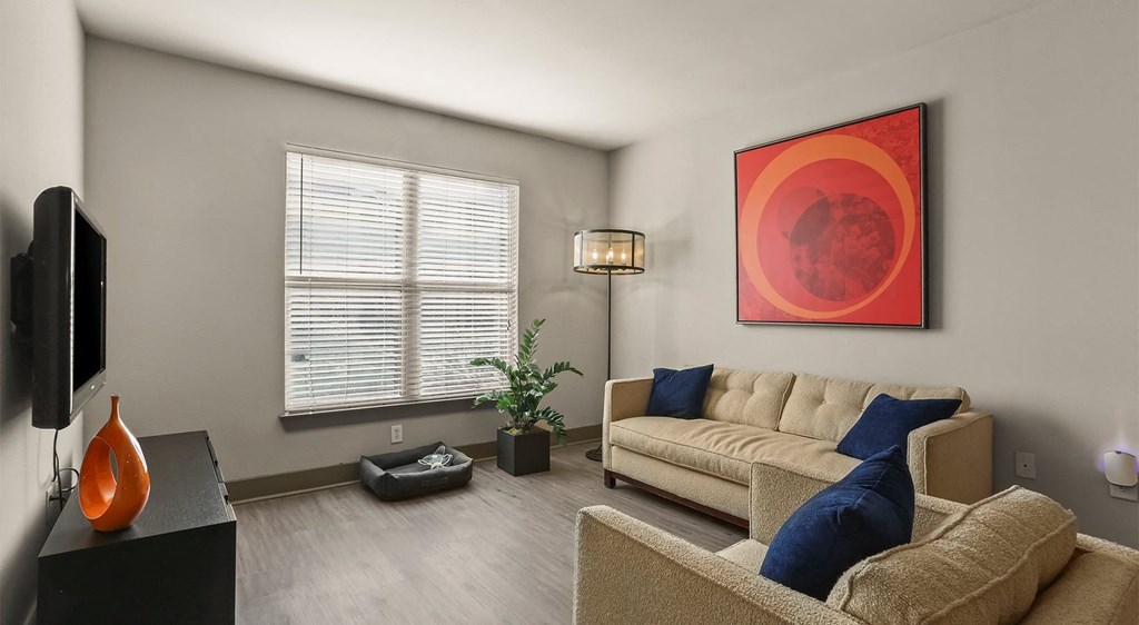 a living room with a couch and a tv