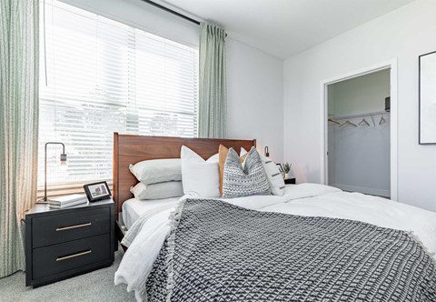 a bedroom with a bed and a dresser with a mirror at RockVue, Broomfield, Colorado