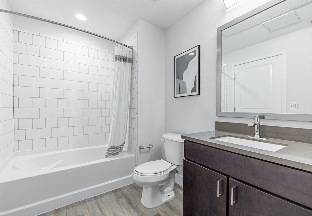 a bathroom with a toilet sink and bathtub