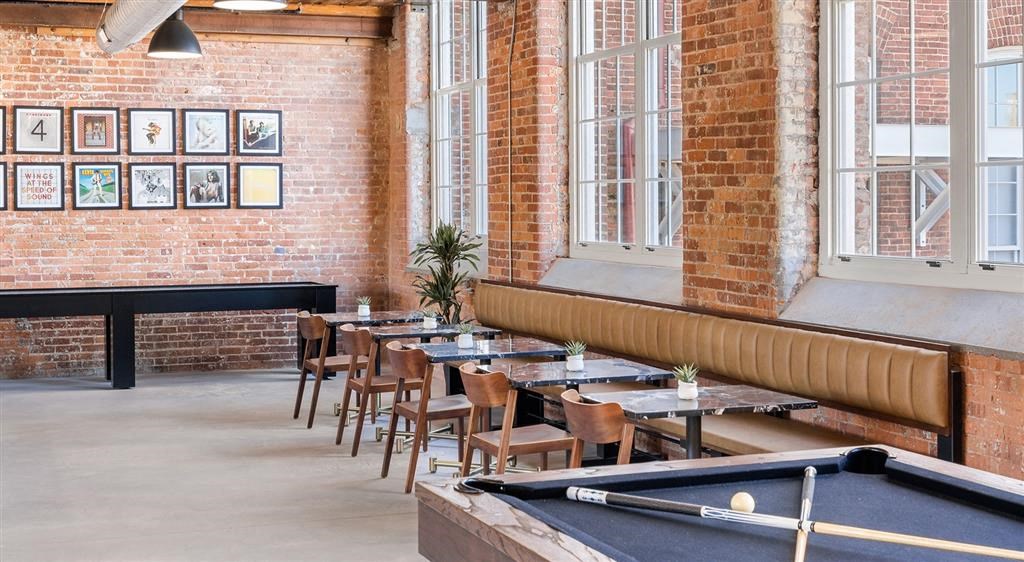 a restaurant with a pool table and tables