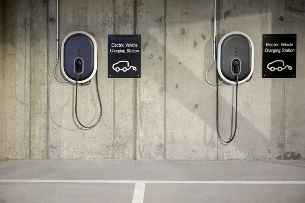 a row of parking meters in a concrete wall