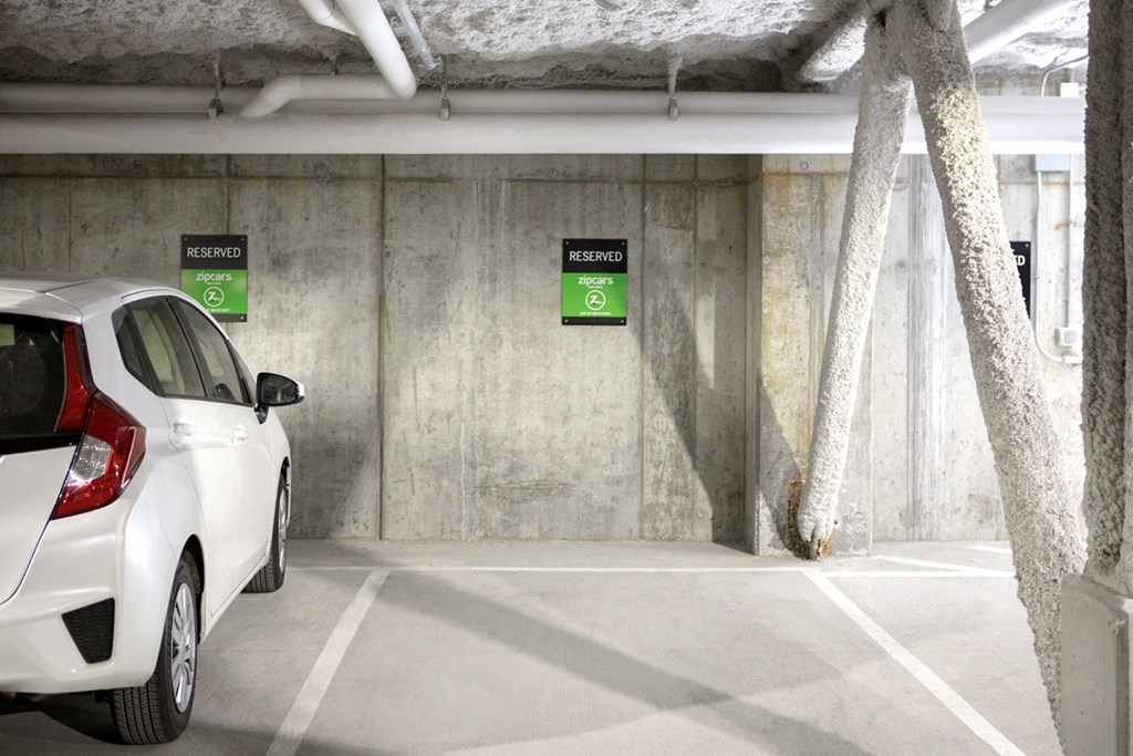 a white car parked in a parking garage