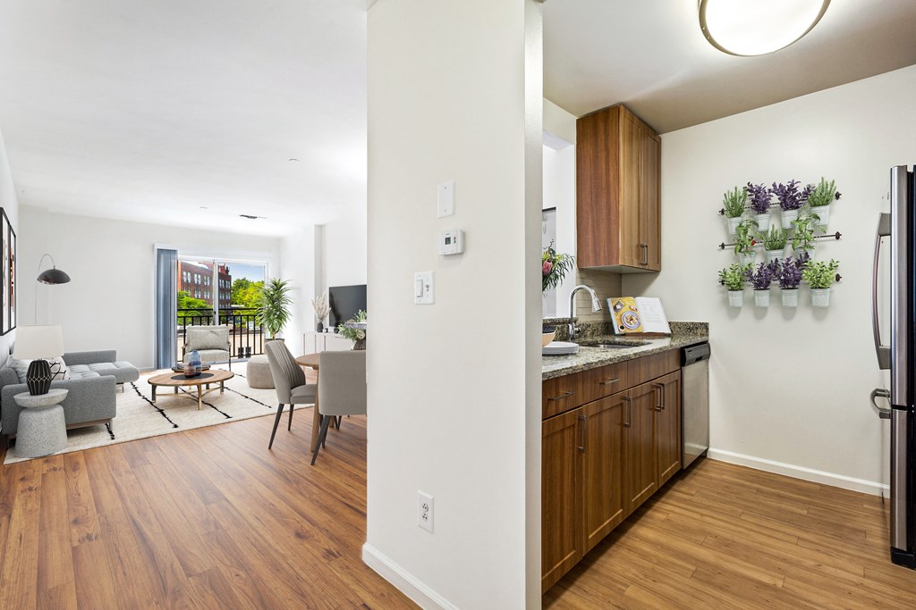 a kitchen and living room in a 555 waverly unit