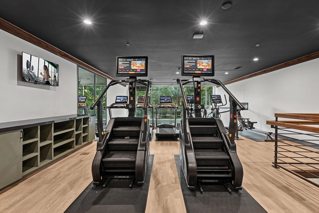 A gym with treadmills and exercise bikes.