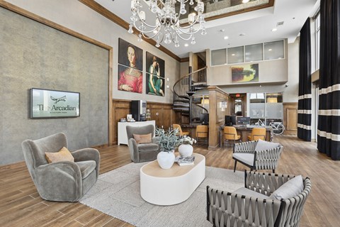 A living room with a grey sofa and a grey armchair.