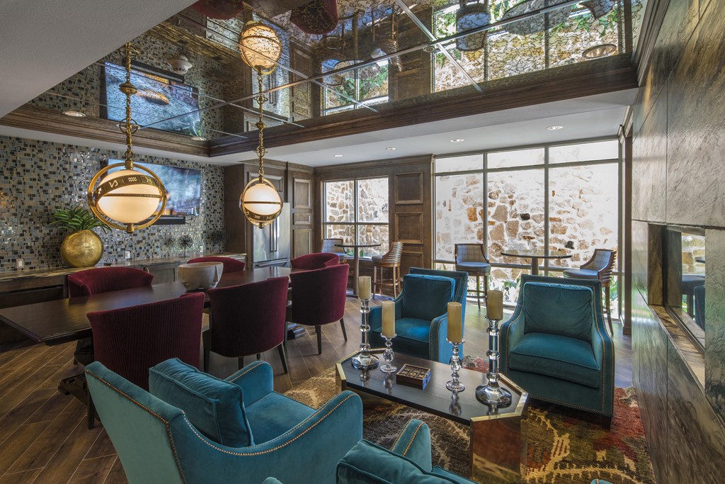 A living room with a glass ceiling and a large window.