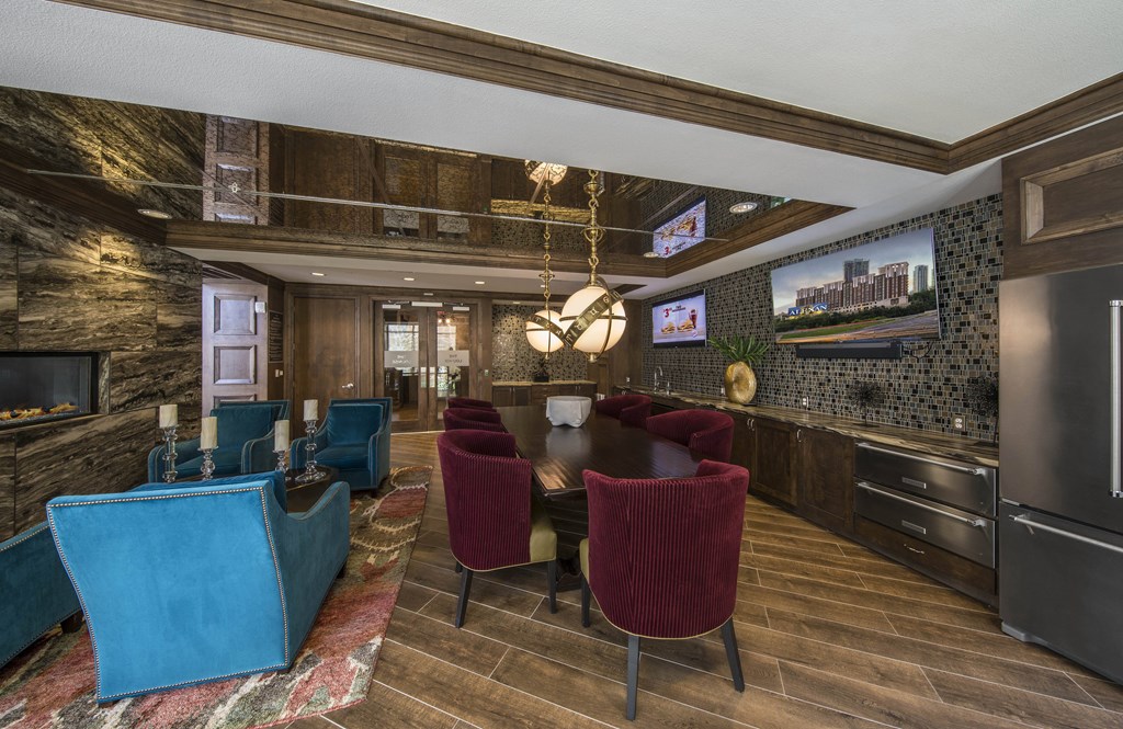 A modern kitchen with a dining table and chairs.