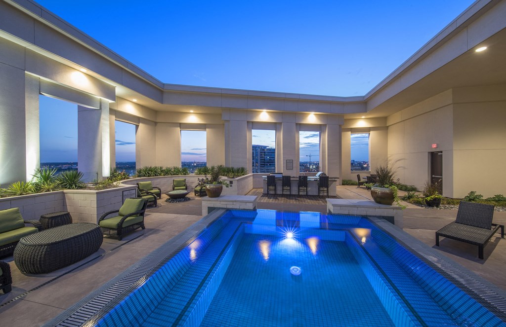 A swimming pool with lights in the middle of it.