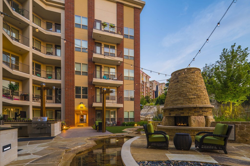 A large brick building with a courtyard and a fireplace.