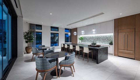 a kitchen and dining area with a large table and chairs