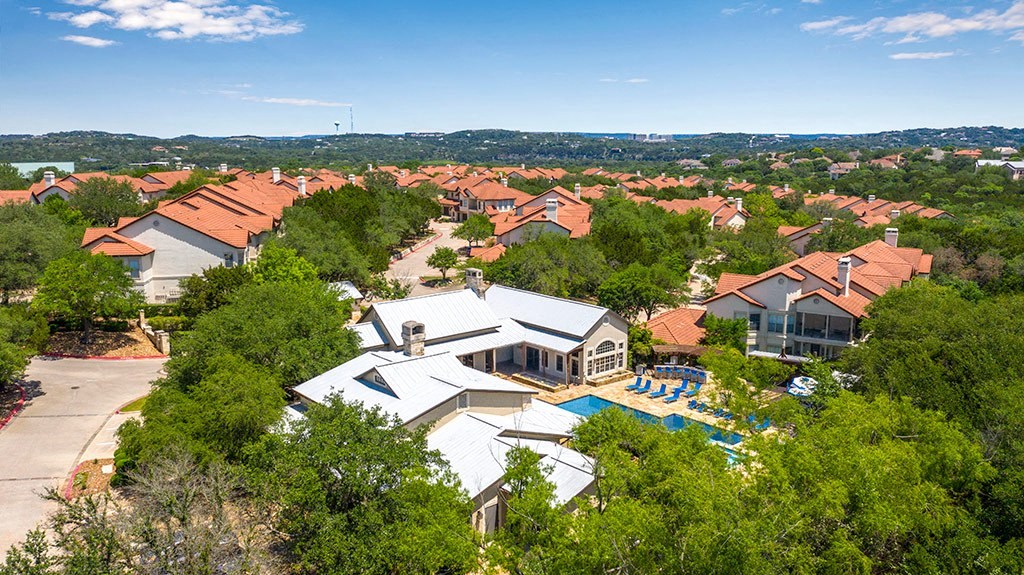 an aerial view of a house with a swimming pool