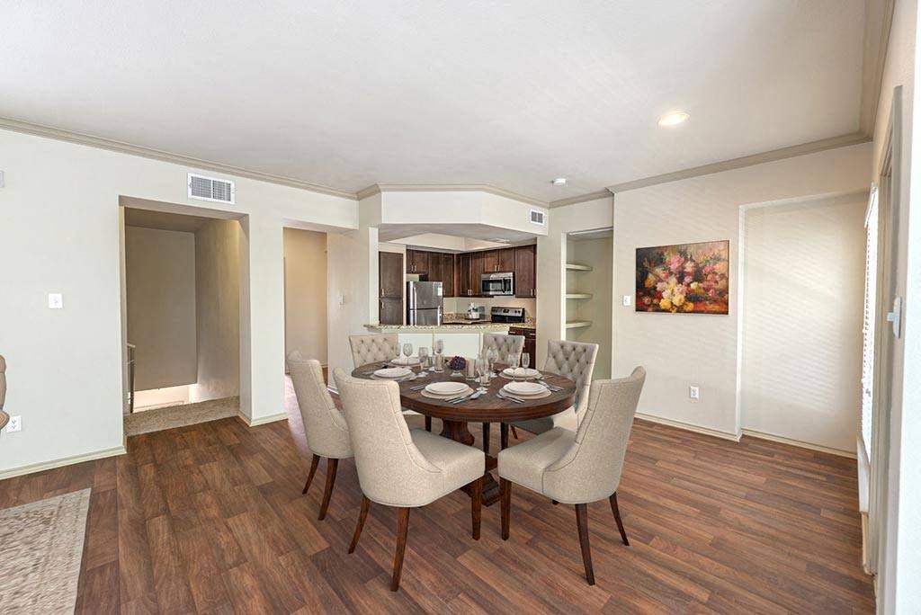a dining room with a table and chairs