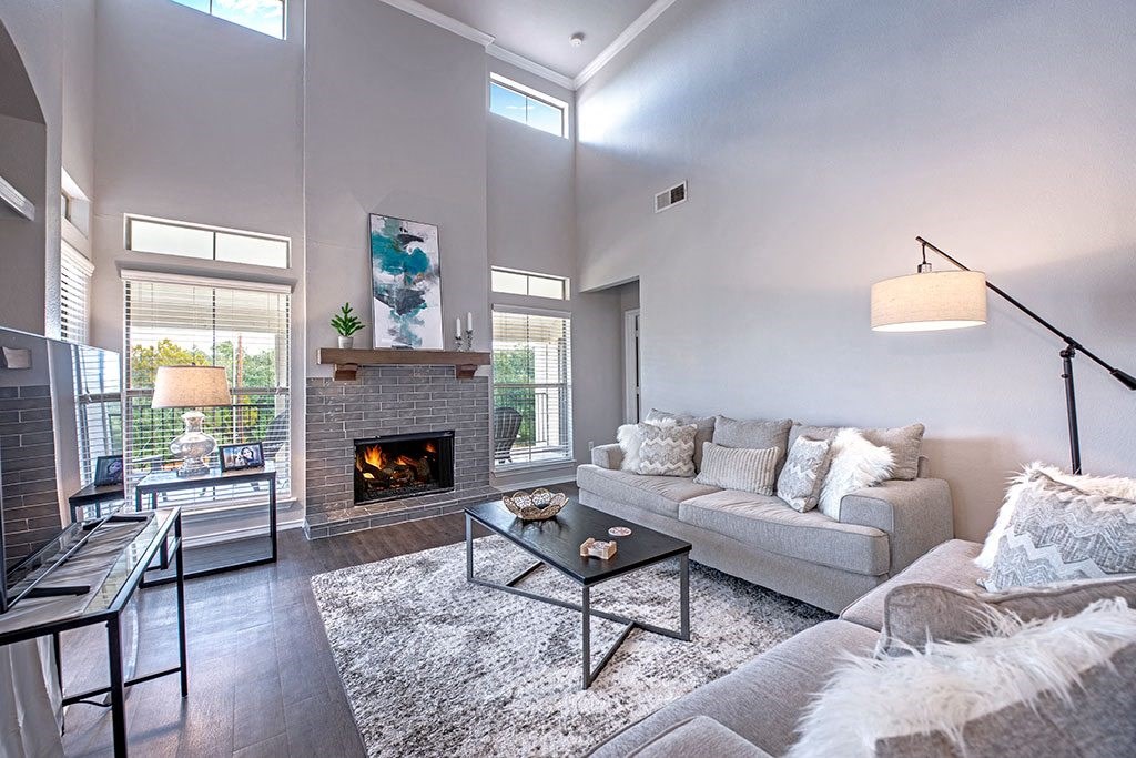 a living room with a fireplace and a couch