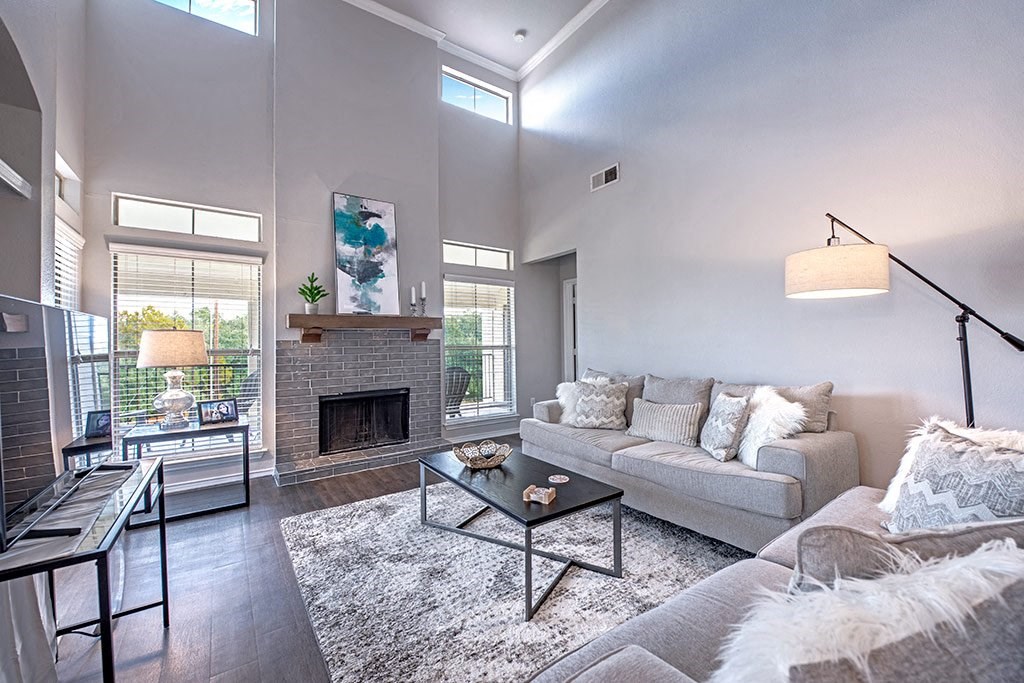 a living room with a couch and a fireplace