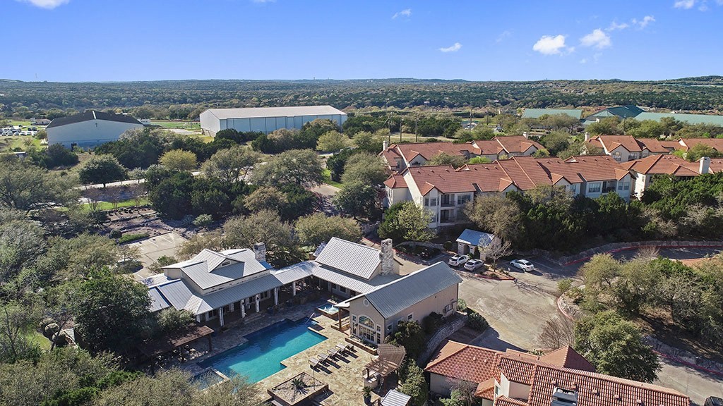 a birds eye view of a house with a swimming pool