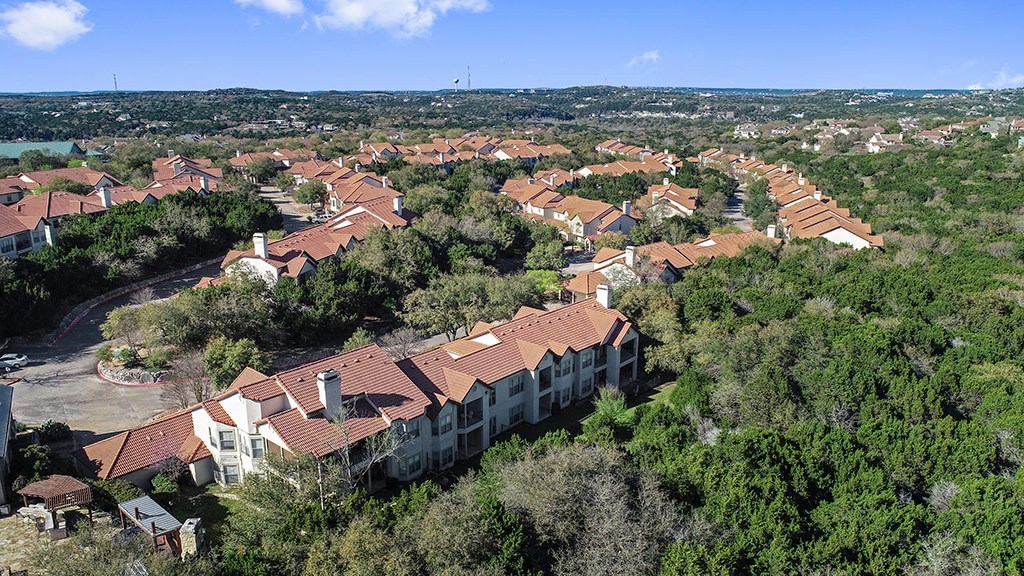 an aerial view of a neighborhood with houses and trees