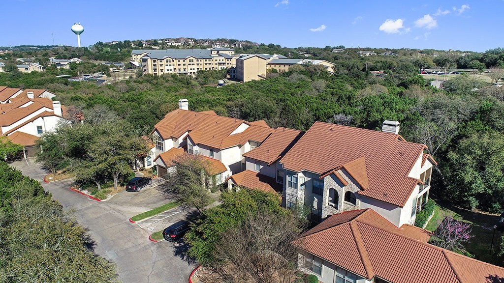 a neighborhood of houses with a water tower in the background