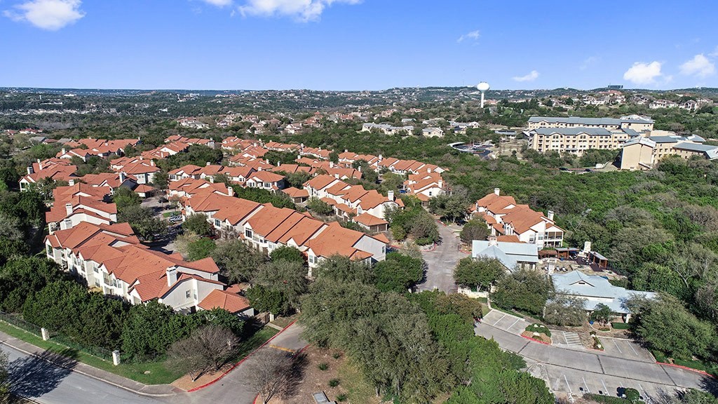an aerial view of a neighborhood with houses and trees