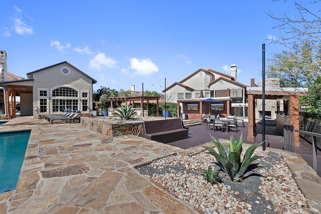 a backyard with a pool and a house