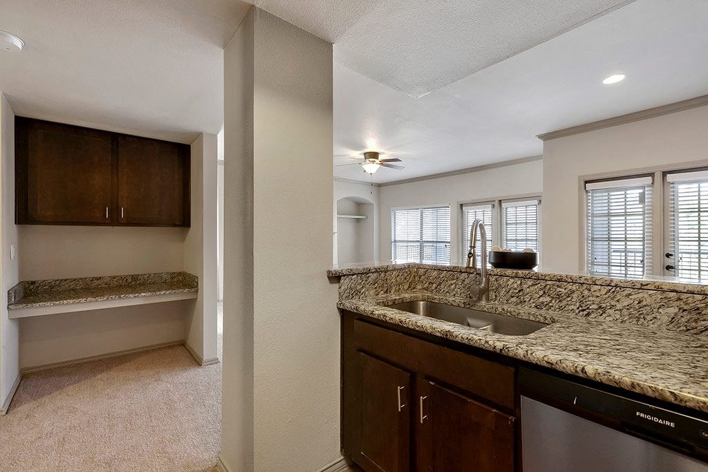 a kitchen with a sink and a counter top