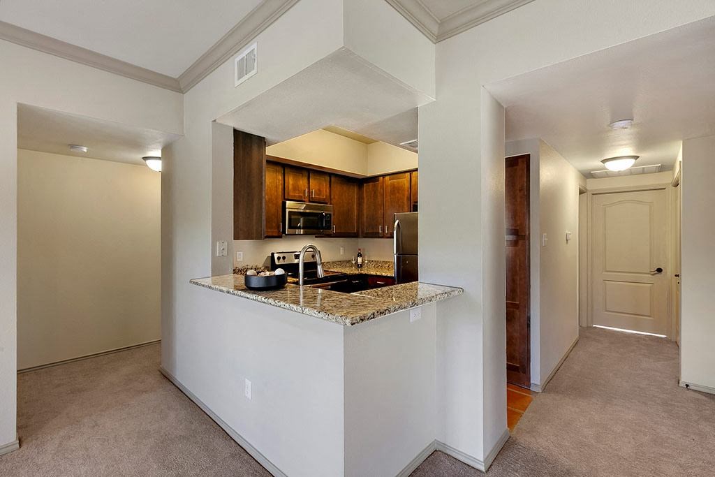 a kitchen with a granite counter top