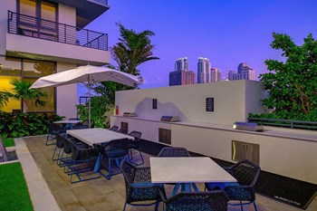 Outdoor Grill With Intimate Seating Area at Caoba Miami Worldcenter, Miami, FL - Photo Gallery 6