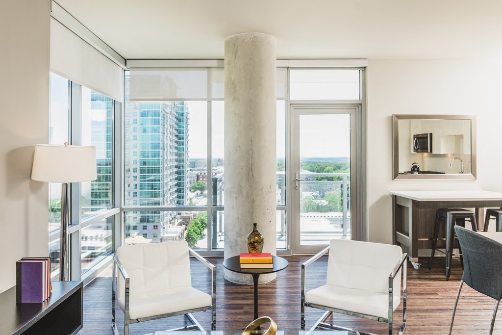 a living room with a column in the middle of the floor