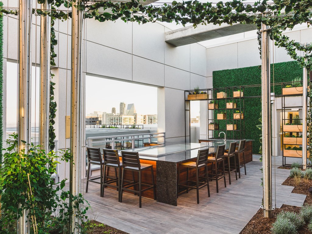 a rendering of a communal table with a view of the city