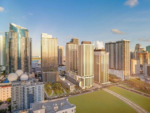 A cityscape with tall buildings and a clear sky.