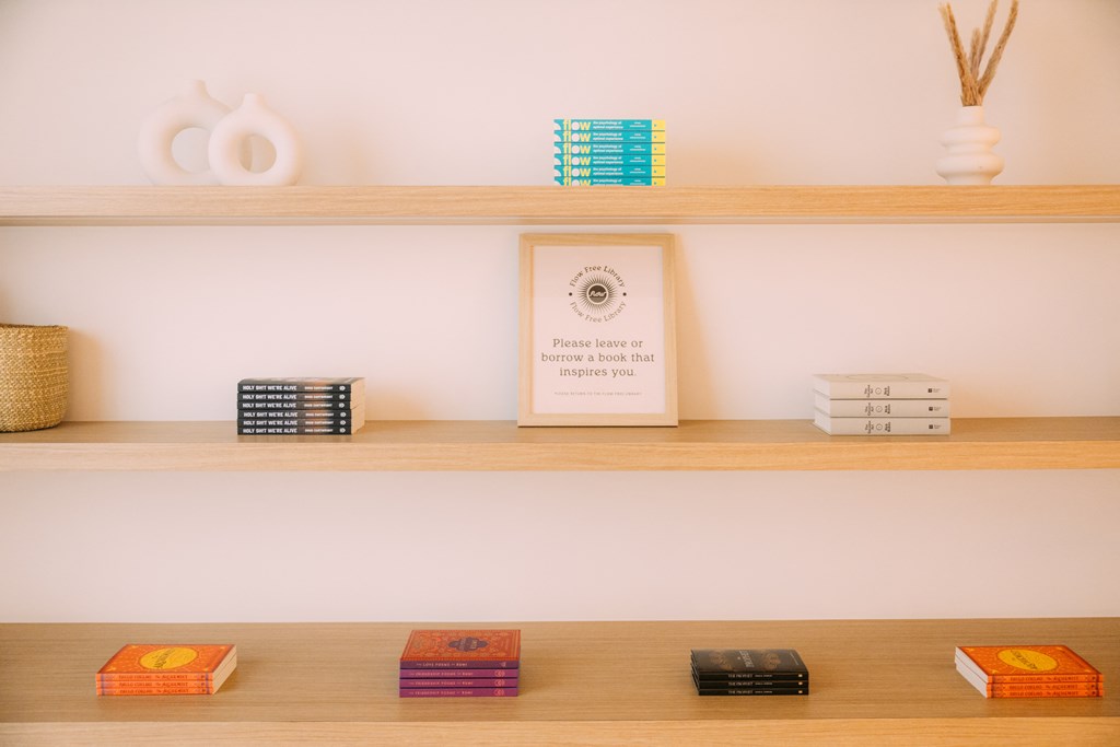 a shelf with books and other items on it