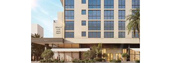 A building with a sign that says "What if it all goes right?" is shown.