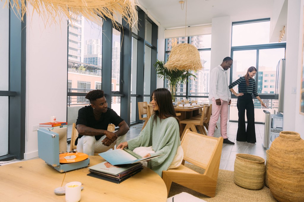 a group of people sitting around a table in an office
