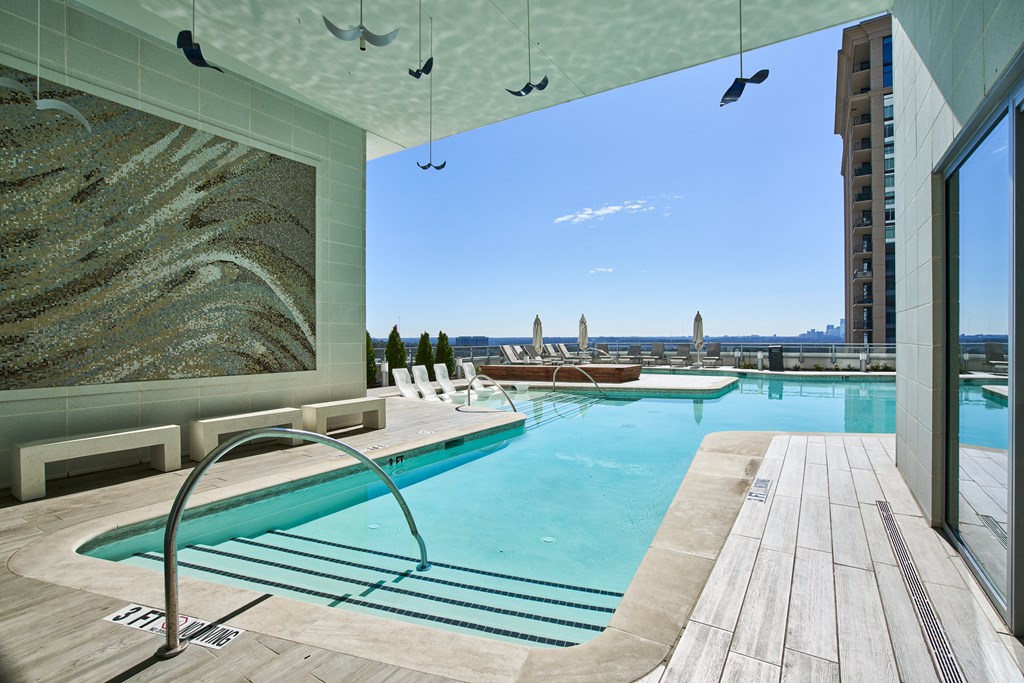 a swimming pool with a view of the city