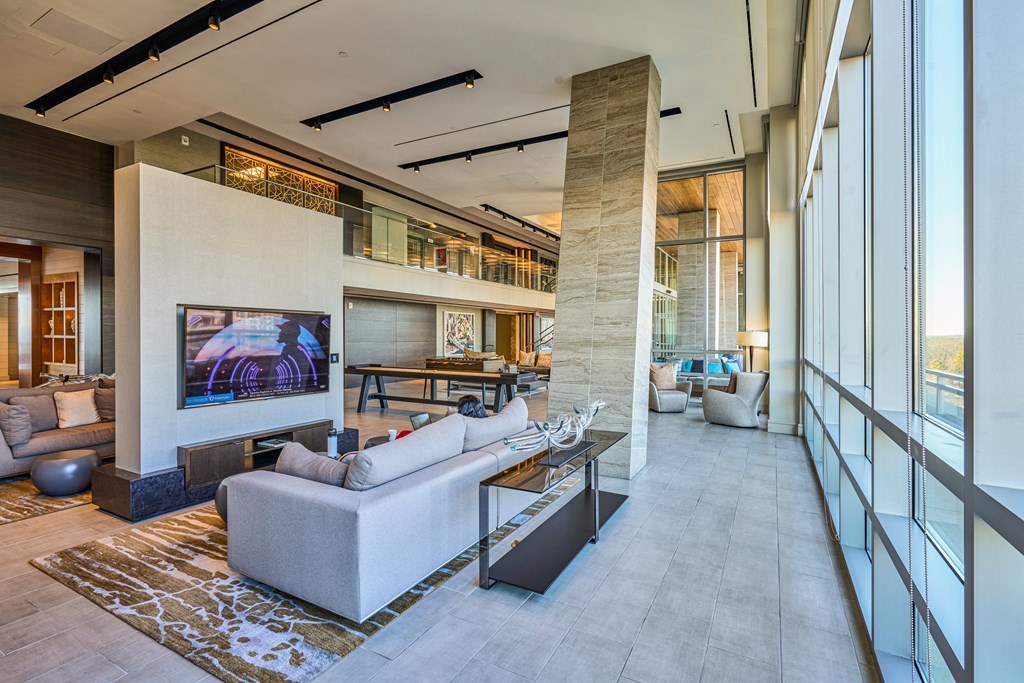 a large living room with a couch and a television